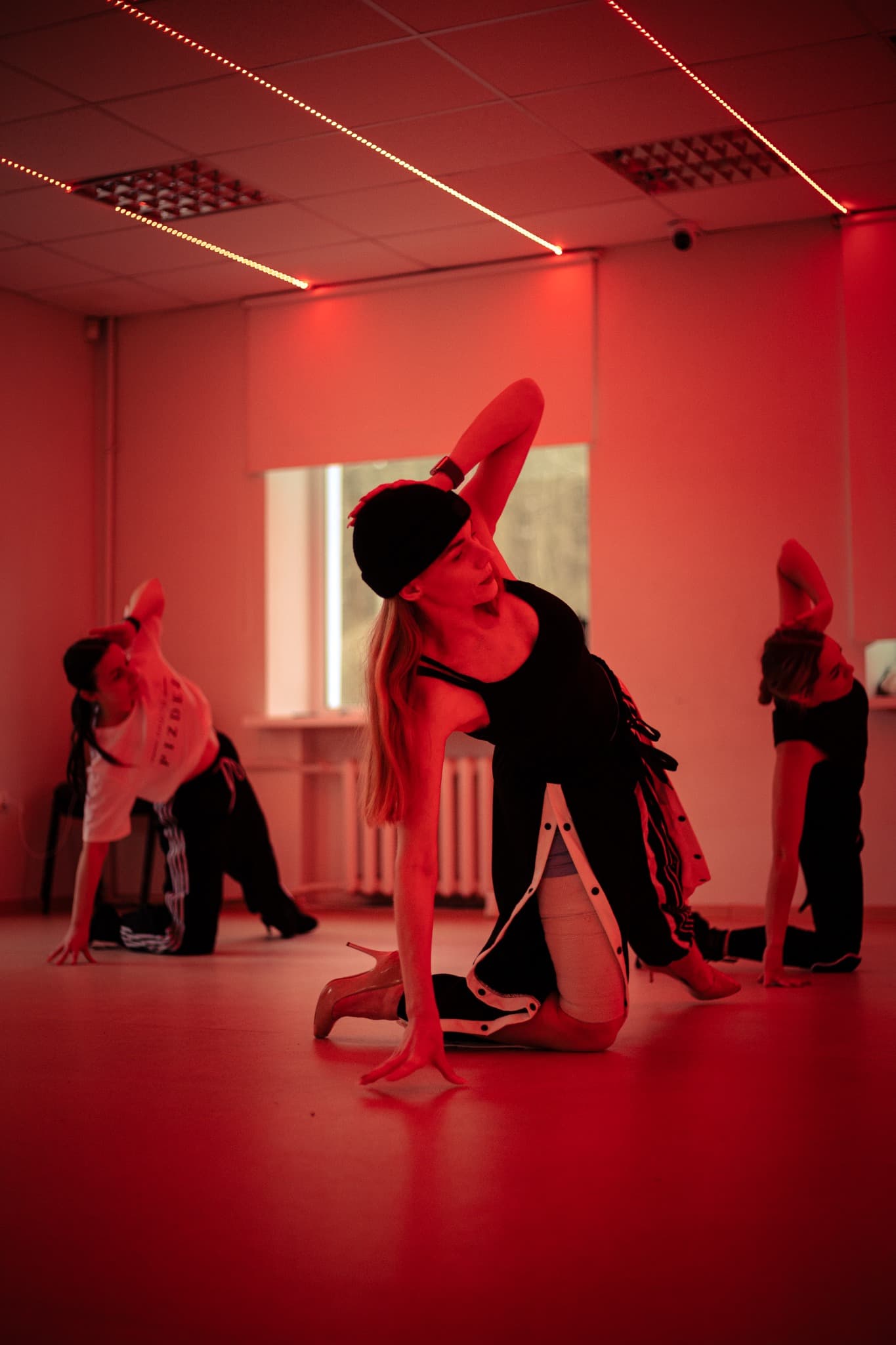 Dance Code heels choreography in red neon studio